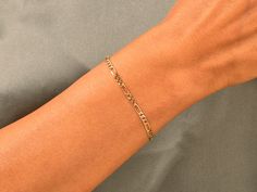 When it's time to upgrade your ensemble, this 14k Yellow Gold 3.0mm Figaro Chain Bracelet is just what you need to add a dash of refinement and elegance. Dainty yet durable, the bracelet features a variety of link designs that make it great for everyday wear. FEATURES • Material: 14k Solid Gold (Stamped 14K for authenticity) • Color Options: Yellow Gold • Chain Style: Figaro Chain • Chain Width: 3.00 mm • Clasp Type: lobster clasp • Available Lengths: 5", 5.5", 6", 6.5", 7", 7.5", 8" For custom Modern 14k Gold Bracelet With Figaro Chain, Everyday 14k Gold Bracelet With Figaro Chain, Everyday 14k Gold Figaro Chain Bracelet, 14k Yellow Gold Figaro Chain Paperclip Bracelet, Yellow Gold Bracelet With Figaro Chain, Adjustable Yellow Gold Figaro Chain Bracelet, Luxury Yellow Gold Figaro Chain Bracelet, Hypoallergenic 14k Gold-filled Yellow Gold Bracelet, Figaro Chains