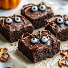 chocolate brownies decorated with googly eyes and pretzels