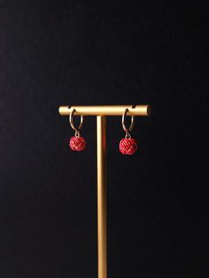 These earrings feature a simple yet beautiful combination of traditional Japanese Mizuhiki cord and classic huggie hoop earrings. Expertly crafted with attention to detail, each earring is made with Mizuhiki cord that is known for its intricate knotting technique. The subtly sparkling Mizuhiki cord will add a touch of elegance to the simplicity.  They are lightweight and comfortable to wear all day long, perfect for daily to formal occasion. ➣COLOR Red with holographic gold ➣SIZE Drop length (Ap Adjustable Red Hoop Earrings, Adjustable Hoop Wrap Earrings As A Gift, Handmade Red Hoop Earrings As Gift, Traditional Red Hoop Earrings As Gift, Knotting Technique, Earrings Japanese, Holographic Gold, Drop Hoop Earrings, Cord Jewelry