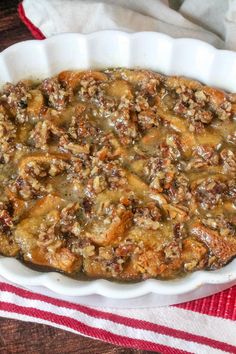 a casserole dish with meat and gravy in it on a table