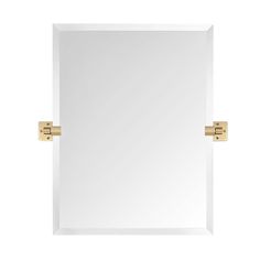 a square mirror with two brass handles on the front and back of it, against a white background