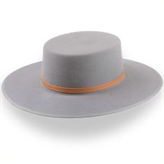 Description Materials Craftsmanship Hat Care Shipping Returns Product Description Bold Grey Wide Brim Flat Top Cowboy Hat Transform your look with the Tycoon, a grey wide brim flat top cowboy hat that combines bold style with practical benefits. Crafted from luxurious rabbit fur felt, this hat features a flat crown and a 3 5/8" wide steel-wired bound brim, providing excellent sun protection and a distinctive appearance. The leather hat belt adds a touch of rustic elegance, while the genuine leat Mens Felt Hats, Spanish Hat, Homburg Hat, Outdoor Hut, Gambler Hat, Mens Hats Fashion, Fedora Hat Men, Homburg, Chapeau Cowboy