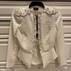 Stunning White Jacket. Size 42 (Italy). Fits Like A Small Brand New. Never Worn Elegant White Embellished Blazer, Fitted White Embellished Outerwear, White Embellished Long-sleeved Blazer, Embellished White Blazer, Designer White Evening Blazer, Luxury White Party Outerwear, Designer Fitted Embellished Outerwear, White Embellished Winter Outerwear, Tailored Embellished Outerwear