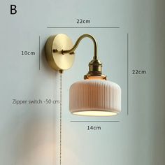 an image of a wall light with measurements for the bulb and arm length on it