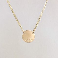 Personalize this gold coin necklace with your name or the name of a loved one, monogram with your initials or a meaningful word. The dainty gold chain may look delicate but it is very strong. The minimalist style adds the perfect amount of sparkle for your everyday outfits. The disc measures 1/2” in diameter. Each necklace is hand crafted and stamped with care with custom text of your choice. Hand stamping is not the same as engraving and lends a softer, more delicate look to this necklace. This Minimalist Initial Pendant Name Necklace With Delicate Chain, Simple Name Necklace With Delicate Chain, Minimalist Nameplate Necklace With Initials, Minimalist Name Necklace With Adjustable Chain For Personalized Gift, Minimalist Name Necklace With Adjustable Chain As Personalized Gift, Simple Yellow Gold Charm Necklaces With Initials, Minimalist Yellow Gold Hand Stamped Charm Necklace, Minimalist Initials Nameplate Necklace, Minimalist Yellow Gold Hand Stamped Necklace