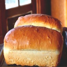 two loafs of bread sitting on top of a table