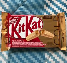 a kitkat bar sitting on top of a blue and white checkered table cloth