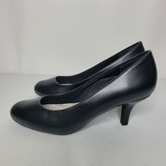 Easy Street Passion Black Leather Pumps Condition: New In Box Measurements: 2.25" Heel Features: -Almond Toe -Flexible Sole -Cushioned Insole For All Day Comfort Call Outs: None Offers Welcome Bundle To Save On Shipping! All Items Ship Same Day Or Next Business Day. Black Polyurethane Heels For Work, Classic Faux Leather Heels, Classic Synthetic Court Shoes With Round Toe, Classic Faux Leather Court Shoes With Round Toe, Black Heels For Work, Formal Heels With Round Toe In Polyurethane, Classic Black Synthetic Court Shoes, Formal Polyurethane Heels With Round Toe, Synthetic Medium Width Court Shoes For Office