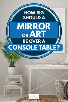 a blue sign that says how big should a mirror or art be over a console table?