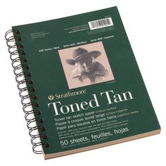 a spiral bound notebook with an image of a man wearing a cowboy hat