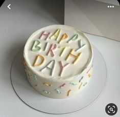 a birthday cake with the words happy written on it