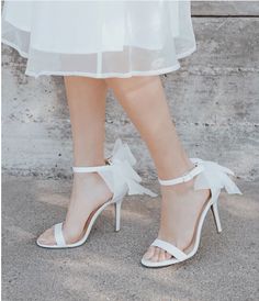 Indulge in elegance with these Women's Bow Ankle Strap Evening Heeled Sandals, perfect for proms or evening events. Crafted from luxurious satin, these sandals feature a charming bow detail at the ankle, adding a touch of femininity to your ensemble. White Bow Heels, Comfortable Wedding Heels, Trendy High Heels, Evening Heels, Ivory Shoes, Soft Sandals, White High Heels, White Sandals Heels, Ankle Strap High Heels