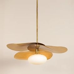 a ceiling fan with two blades and a light bulb hanging from it's side