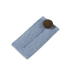 a button is attached to the back of a blue jean fabric pocket with a white background