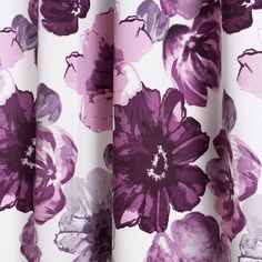 purple and white floral print curtains hanging on a window