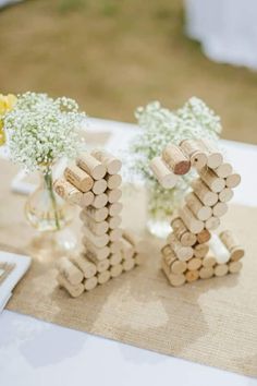 two wine corks are stacked on top of each other to form the word love