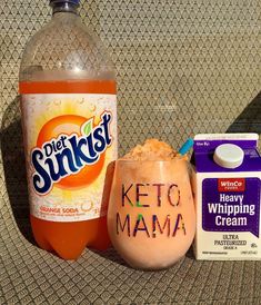 a bottle of keto mama next to a cup of yogurt and a carton of sunstory