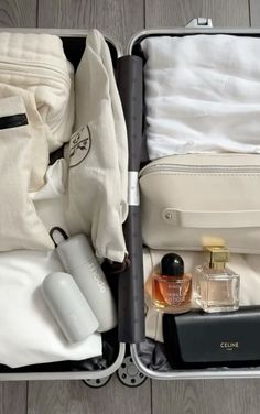 an open suitcase filled with personal care items