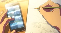 someone is drawing on paper with a pencil and cell phone in front of them, while another person holds a pen