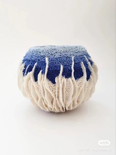 a blue and white object sitting on top of a table