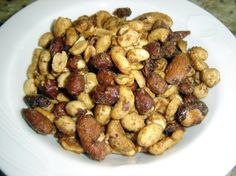 a white bowl filled with nuts on top of a table