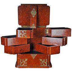 an assortment of wooden boxes stacked on top of each other with decorative designs in them