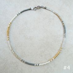 "These anklets are hand beaded with carefully picked color combinations. Delicate and simple, yet very strong! Stringed on a very strong steel wire and the claps and ring is made out of stainless steel as well. The beads are high quality Japanese glass beads. I can do all kinds of colors, so let me know if you have any other colors in mind! The one you see on the pictures are 10\" long, but I can make them any size and the size depends on really on where you want it to be on your ankle as well. Minimalist Handmade Anklets With Round Beads, Minimalist Handmade Beaded Anklets, Faux Nose Ring, Summer Bracelets, Diy Rings, Beaded Anklets, Beaded Bracelets Diy, Seed Bead Necklace, Mix Color