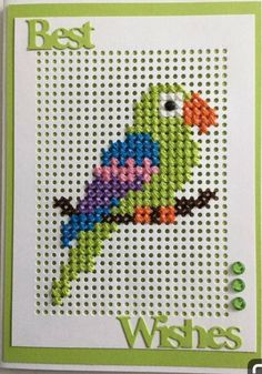 a cross stitch card with the words best wishes written on it and a colorful bird