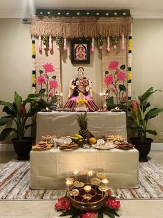 there is a small shrine with food on the table