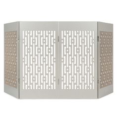 a white room divider with an intricate design on the front and side panels,