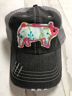 Embroidered Floral show pig trucker hat. Distressed hat that is non structured with Velcro closure. Spring Trucker Cap, Country Style Adjustable Trucker Hat For Spring, Adjustable Country Style Trucker Hat For Spring, Country Style Trucker Hat For Spring, Country Style Cap For Spring, Spring Embroidered Patch Trucker Hat, Country Style Baseball Cap For Spring, Spring Country Style Baseball Cap, Country Style Spring Baseball Cap