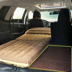 an inflatable mattress is placed on the back of a car