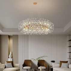 a living room filled with furniture and a chandelier hanging over it's head