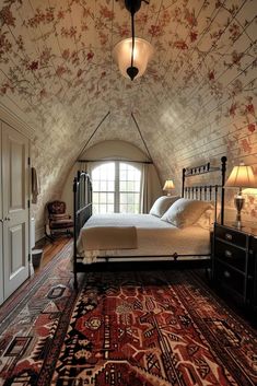 a bedroom with a bed and rug on the floor