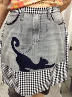 a person wearing a skirt with a cat on it