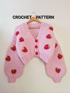 a pink knitted cardigan with strawberries on it and the words crochet pattern written below