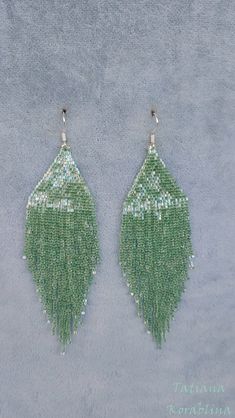 These handmade author's bright sparkling iridescent earrings are made of high-quality Japanese microscopic beads Delica. These earrings look very elegant and weightless. Color:mint . 100% hand made with love! Measurements: Length with hook - about 11.5 cm( 4,52 inch ),Width -3 cm (1,18 inch) Materials: Silver plated ear hooks Japanese microscopic beads Delica Tytan Threadbeige Seed Bead Earring, Fringe Earring, Bead Earring, Beaded Earring, Wedding Etsy, Seed Bead Earrings, Ear Hook, Fringe Earrings, Beaded Lace