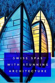 the cover of swiss spas with stunning architecture in blue and yellow colors, surrounded by snow - covered trees