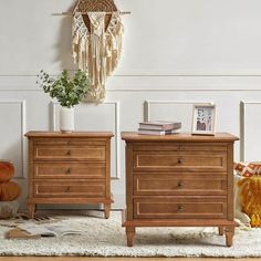 two wooden dressers sitting next to each other on a rug