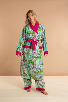 Our Bali women's cotton robe has a pattern inspired by summer in the Tropics. Featuring deep pockets, a bright pink contrast collar, and an inner drawstring for security, this long luxury dressing gown is made from soft and breathable 100% Indian cotton. The standout teal floral pattern is perfectly offset by contrast fuchsia hems, collar, cuffs, and tie, making this robe a joy to wear at home, on the beach, or anywhere else you desire. Becky is 171cm / 5'8'' and wears size S/M Pink Cotton Sleep Robe, Pink Cotton Robe For Daywear, Pink Cotton Home Robe, Pink Cotton Vacation Robe, Tie Making, Early Night, Cotton Dressing Gown, Pink Contrast, Contrast Collar