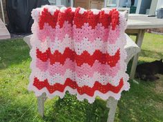 "This Strawberry Ripples Baby Blanket is one of the cutest afghan patterns I created, and I’m so excited to share it with you.  This baby blanket has a multicolored lacey blanket framed by a delicate, fan border. And as the name suggests, I took a lot of inspiration from strawberries, especially color-wise.   used DK (light worsted #3) yarn in red, pink and white, but if you want a thick, warm blanket, you can opt for Aran (worsted #4) yarn.  Because the blanket is made with a gorgeous stitch