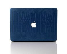 an apple macbook air case in blue crocodile skin