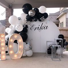 balloons and letters are displayed in front of a sign that says egika on it