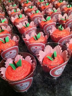 many cupcakes are arranged in small cups