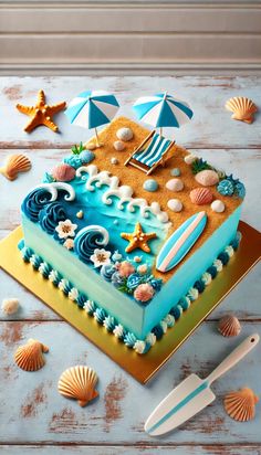 a blue and yellow cake sitting on top of a table next to seashells