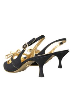 The autumn-winter collection includes the Lori slingback pumps, featuring kitten heels and elegant embellishments, highlighted with a narrow gold nappa piping on the edges. Noticeably, the vamp strap is adorned with large sparkling crystals and a voluminous bow in a matching material. Suede embellished slingback heels shoes. Model: Slingback heels Color: Black, Gold Material: 51% Silk 49% Leather Buckle closure Leather bottom sole Made in Italy Formal Evening Slingback Pumps, Luxury Low Heel Slingback Pumps For Party, Designer Gold Slingback Pumps For Evening, Elegant Low Heel Slingback Pumps For Gala, Elegant Low Heel Kitten Heels For Evening, Designer Gold Slingback Pumps For Formal Occasions, Luxury Gold Kitten Heels For Formal Occasions, Elegant Kitten Heels With Heel Strap For Gala, Elegant Evening Kitten Heels With Heel Strap