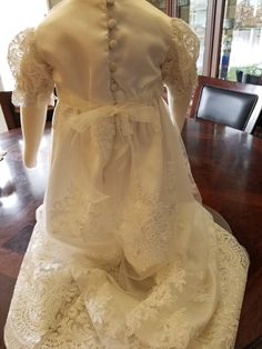 "FREE SHIPPING IN THE U.S. and reduced shipping rates for International orders. This beautiful gown is a wedding dress conversion, but it can be made from similar fabric from my shop. Satin bodice with puffed sleeves and a scalloped lace edge. Skirt also has the scalloped lace edge. Satin ribbon around the waist, secured with loop fasteners at the side seams, bow can tied in front or back. Bridal looping and satin buttons close the back. Gown is made heirloom quality with French seams and hand f Fitted Gown With Lace Bodice For Pageants, Fitted Gown With Lace Bodice For Pageant, Lace Ball Gown Pageant Dress For Wedding, Cream Ball Gown Wedding Dress, Organza Pageant Dress With Fitted Bodice For Wedding, Elegant Ball Gown With Fitted Bodice For First Communion, Pageant Wedding Dress With Lace And Fitted Bodice, Wedding Pageant Dress With Fitted Bodice In Organza, Pageant Wedding Dress With Lace Bodice