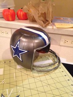 a football helmet sitting on top of a cutting board