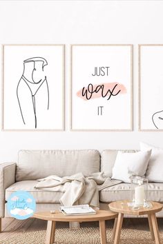 three art prints hanging on the wall above a couch and coffee table in a living room