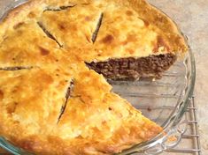 a pie sitting on top of a glass plate